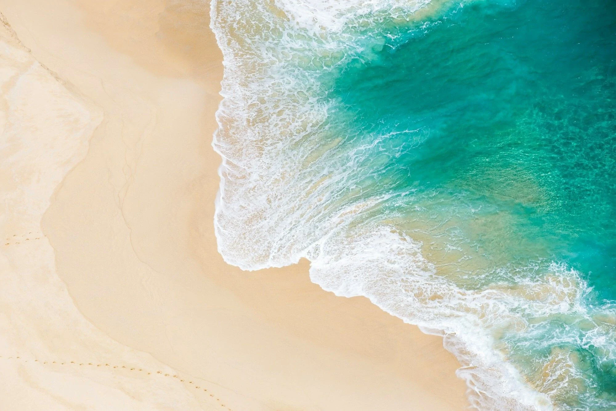 Aerial view of a turquoise shoreline