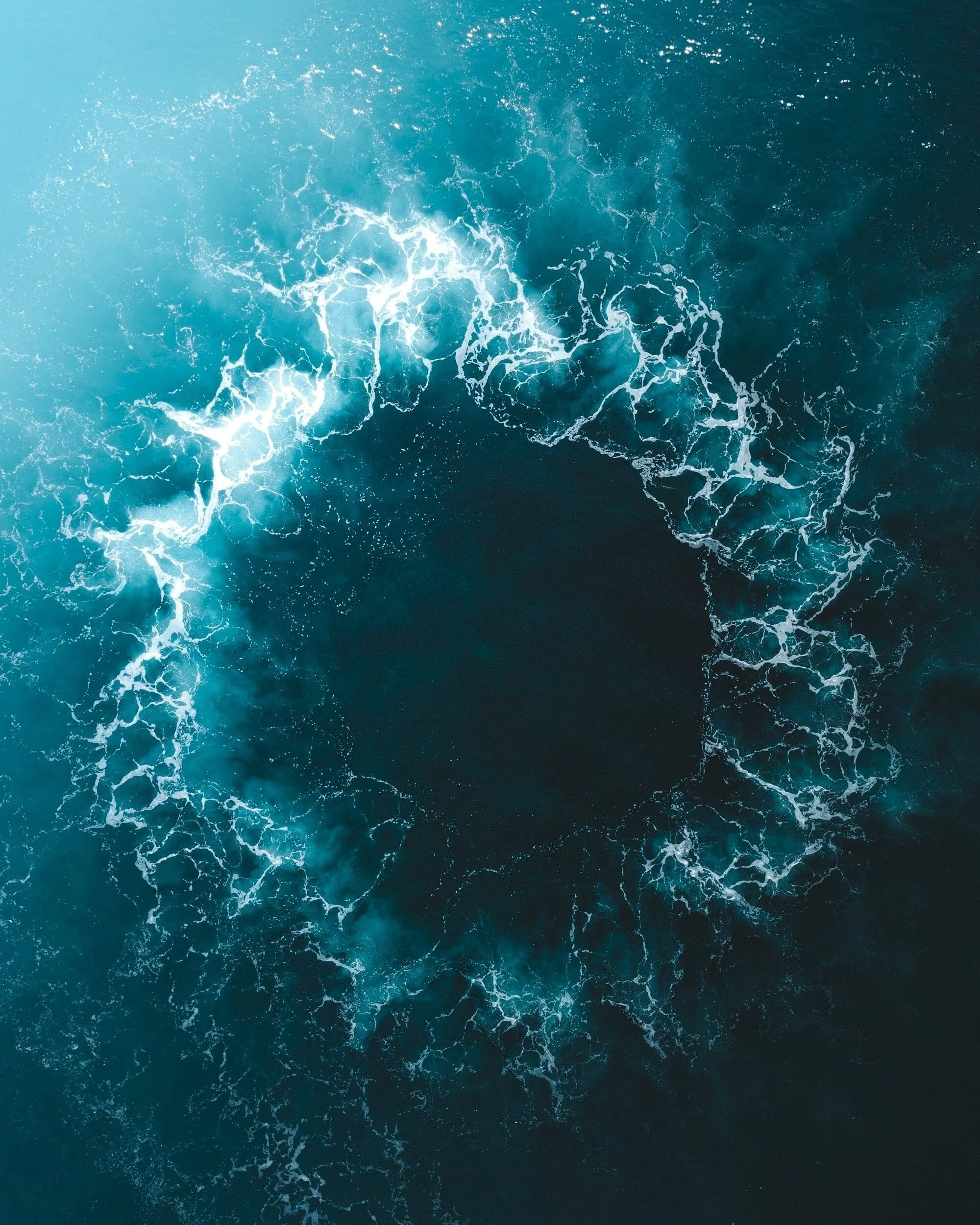 Deep blue ocean waves seen from above